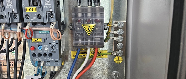 Industrial control panel with Siemens contactors and a fused terminal block wired for three-phase 380V supply